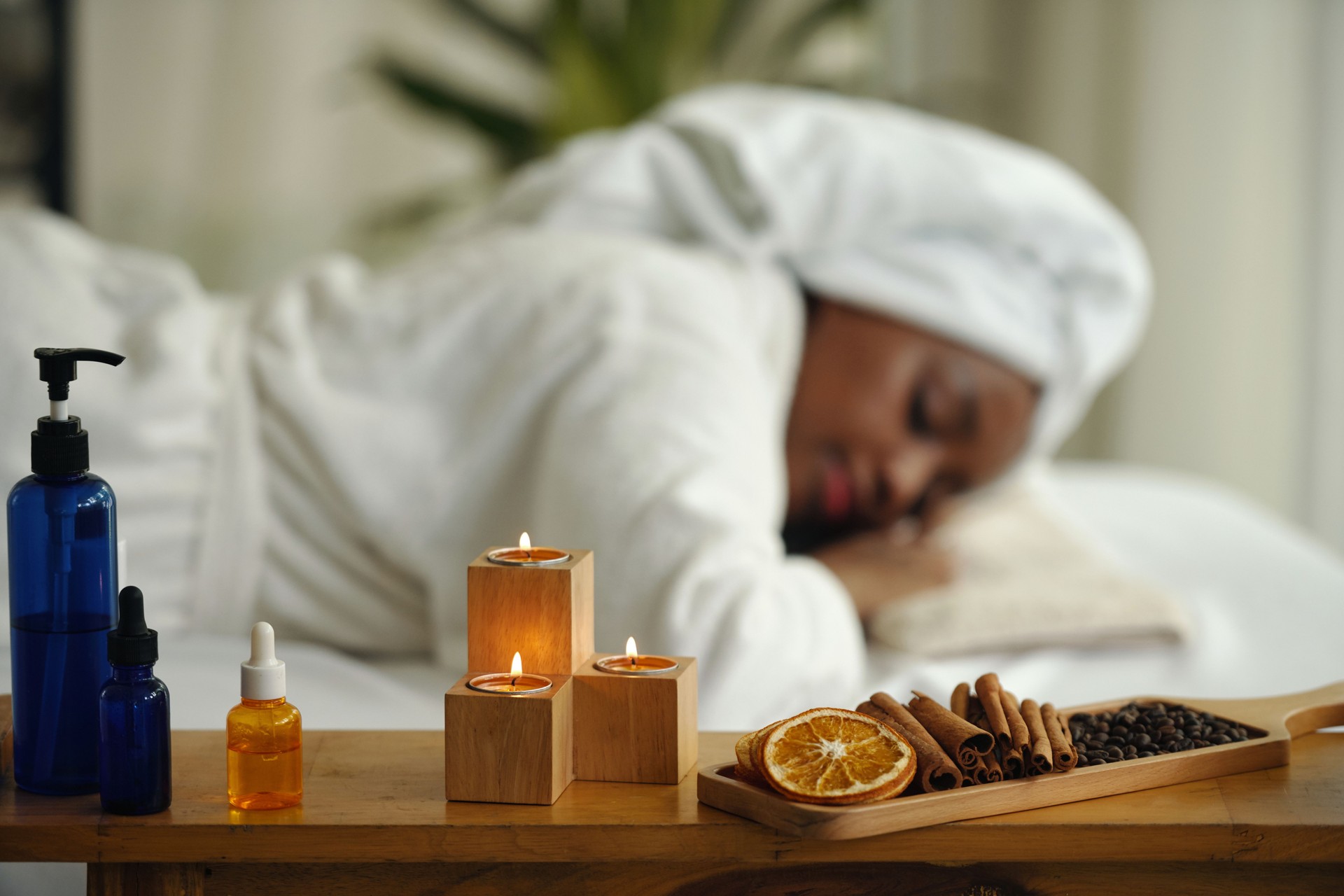 Enjoying Relaxing Spa Treatment with Aromatherapy Candles